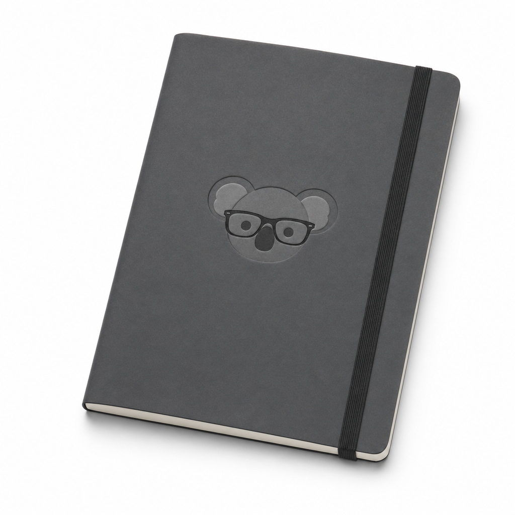 Charcoal softcover notebook with a debossed koala and elastic closure