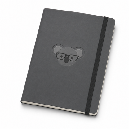 Charcoal softcover notebook with a debossed koala and elastic closure